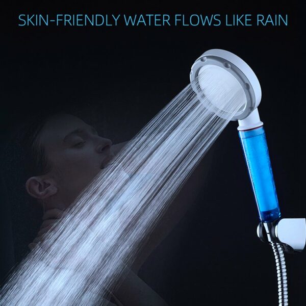 Close-up of a person enjoying a handheld shower. Water flows smoothly, and the text reads, "Skin-friendly water like rain.