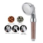 Handheld shower head with visible mineral beads: features include Mineralized and Anion Balls, Rain Spray, Massage Jetting, and combined modes.