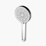 A modern handheld showerhead with a circular face, many small holes, and a sleek silver handle for a minimalist look.