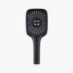 Black rectangular handheld shower head with multiple white spray nozzles and a circular cluster of four larger nozzles in the center.