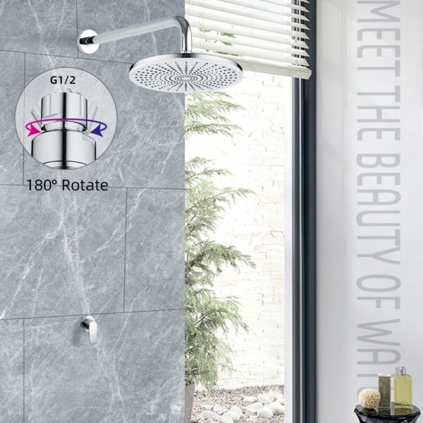 Cuarto de baño moderno con ducha de efecto lluvia de 180° sobre una pared de azulejos grises. Ventana vertical con persianas abiertas a la derecha. Texto: "CONOCE LA BELLEZA DE W".