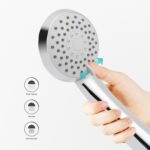 Hand holding a showerhead with three spray modes: rain, massage, and rain massage.