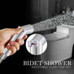 Hand holding bidet shower with flow control switch. Modern toilet in background. Text: "Bidet Shower Adjustable Flow Control.