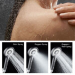 Close-up of a person in the shower with water spraying on their shoulder. Below are images showing three showerhead spray options: Rain, Oxygen, and Oxygen+Rain.