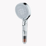 Silver handheld shower filter for hair and skin and black, white, and brown beads in the handle.