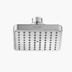 A square fixed shower head with multiple nozzles is attached to a pipe on a plain white background.