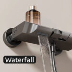 Close-up of a gray bathroom fixture with a cascading spout and liquid soap on top. "Waterfall" appears in bold white text on black.