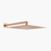 Elegant large rain shower head with ultra-thin stainless steel design in rose gold finish, mounted on a white wall.