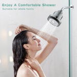 Shower woman enjoying water spray in shower head, relaxing and bathing, clean and refreshing shower experience.