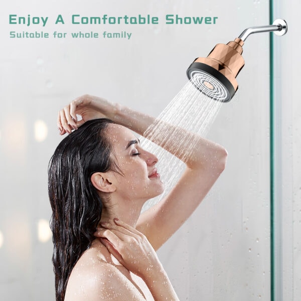 Shower head with rose gold finish delivering a relaxing spray, woman enjoying a shower, close-up of water flow, modern bathroom setting, luxury shower fixture.