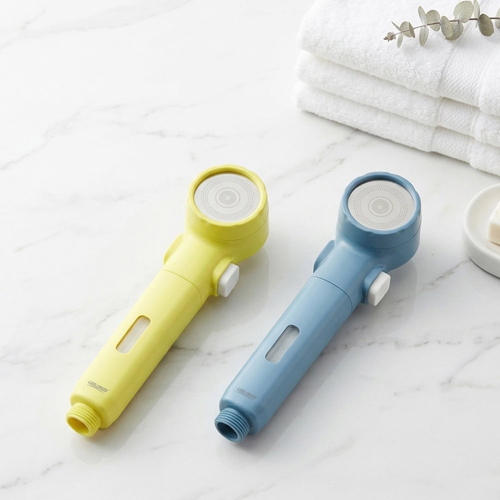 Colorful portable travel hand shower heads in yellow and blue with PP cotton filters, ideal for travel and outdoor use.