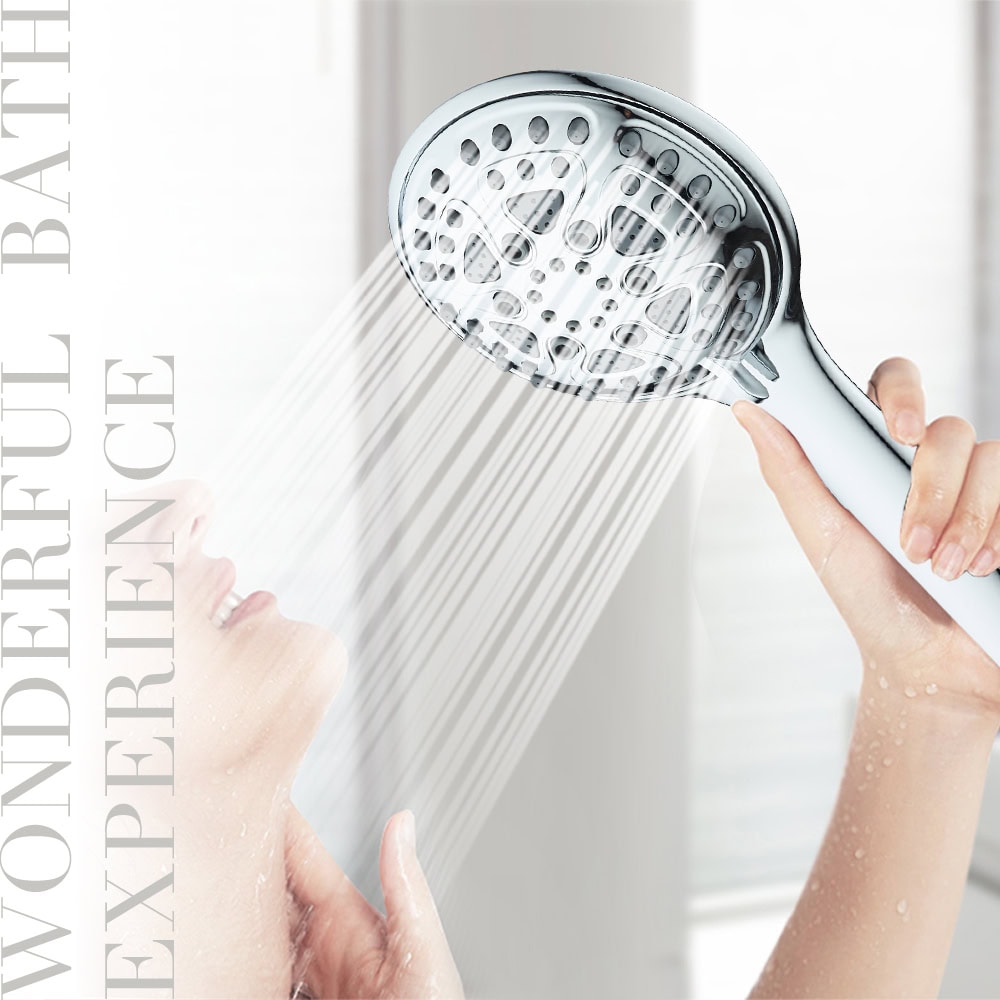 Person enjoying a luxurious high-pressure rain shower head with adjustable settings in a modern bathroom.