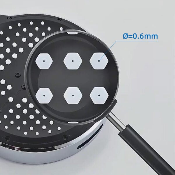 Close-up of high-pressure shower head with six hexagonal nozzles, each with a 0.6mm diameter, designed for optimal rainfall and massage modes.