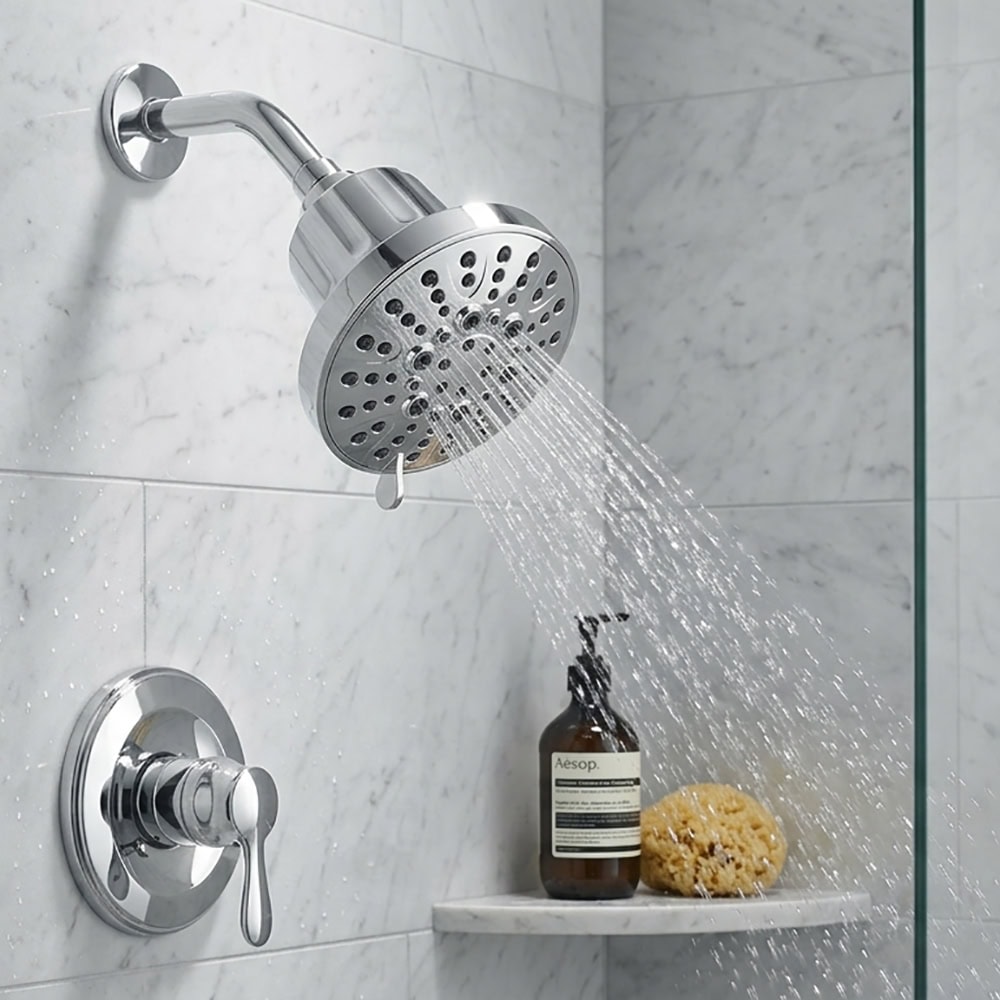 Modern shower head with filtration system installed in a bathroom with marble tiles, water flowing from the shower head.
