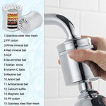 Close-up of a person installing a 15-stage shower filter with multiple mineral balls and stainless steel mesh for water purification.