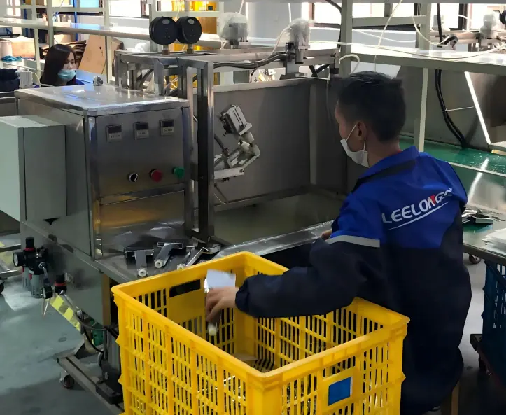 Factory worker wearing a mask and blue uniform operating machinery at Leelongs manufacturing plant.